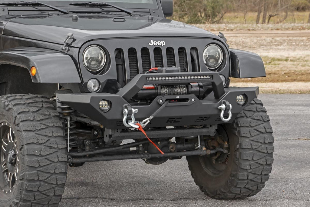 Rough Country full-width front winch bumper with LED light bar on Jeep Wrangler